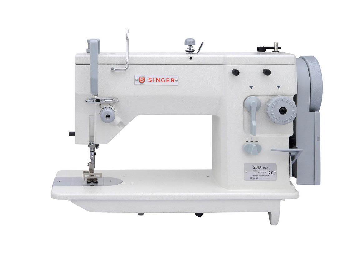 a white singer industrial zig zag machine with light grey trimming