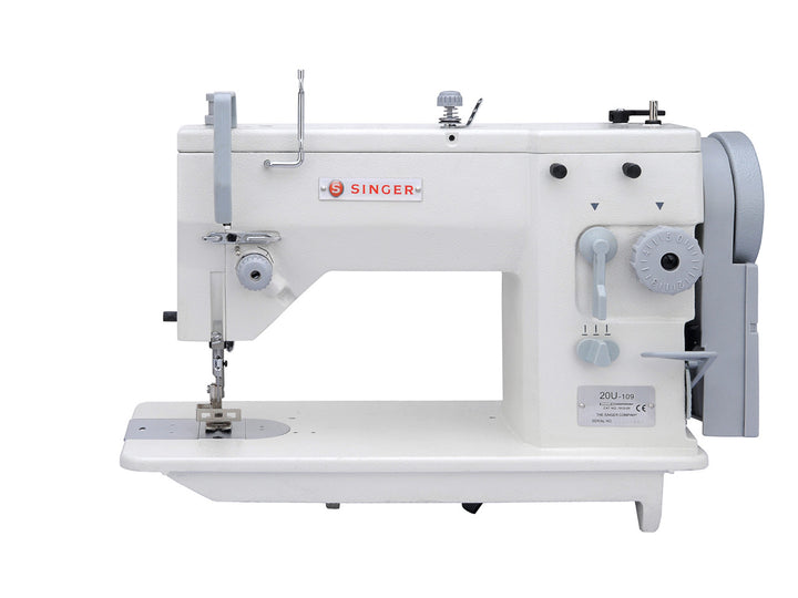 a white singer industrial zig zag machine with light grey trimming