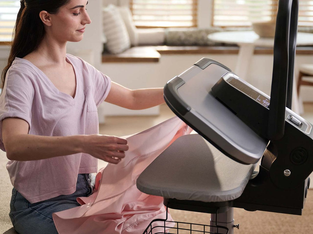 lady-using-the-esp36-steam-press-stand-folding-a-shirt-for-sale