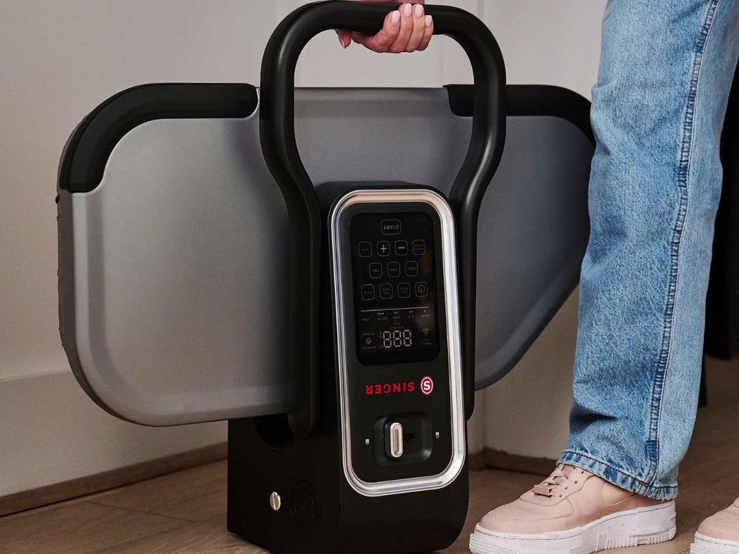 singer-esp26-steam-press-being-carried-by-handle-for-sale